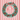 Christmas wreath with red berries and a red ribbon on a red and white striped background.
