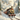 Vintage steam train in a snowy landscape with mountains and trees,