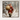 Framed artwork of a Santa Claus figure with a large sack walking through a snowy forest.