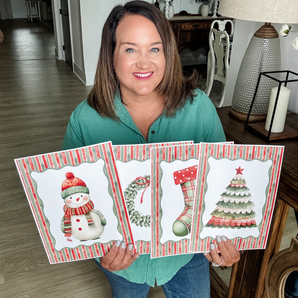Christmas themed printables being held 