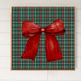 Framed artwork of a red bow on a plaid background