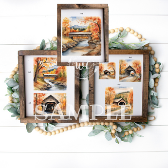 Wooden photo frame with multiple small pictures of a covered bridge and autumn scenery, surrounded by greenery on a white background.