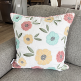 White pillow cover with pastel florals 