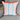 colorful striped summer pillow cover with orange edging on grey chair