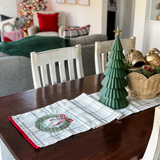Christmas themed table runner on wood table 