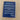 Blue notebook with text on a wooden surface