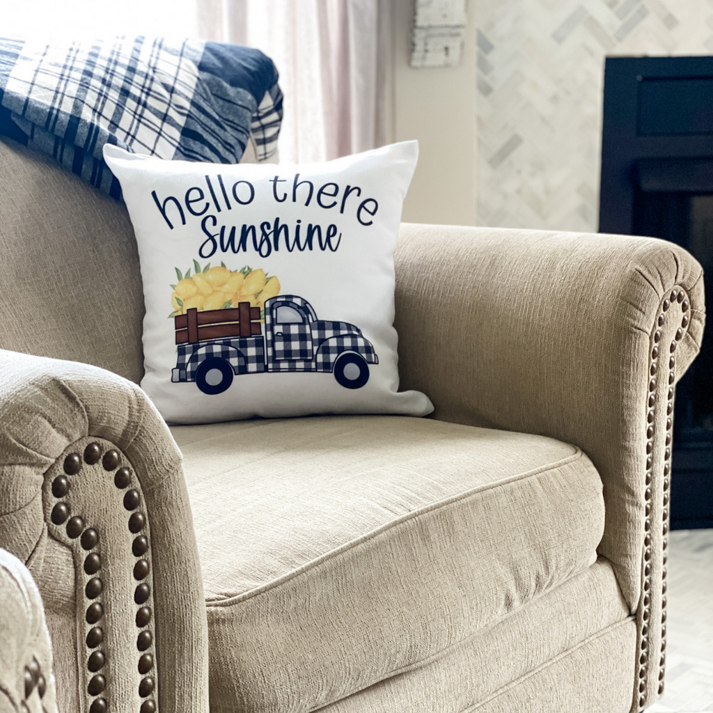hello there sunshine pillow on chair